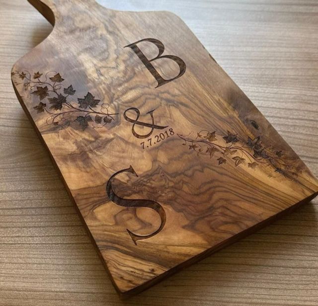 Olive wood board engraved with initials, a date and an ivy motif